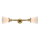 Cone Bath Vanity Light shown in the Brushed Brass finish with a Matte White shade