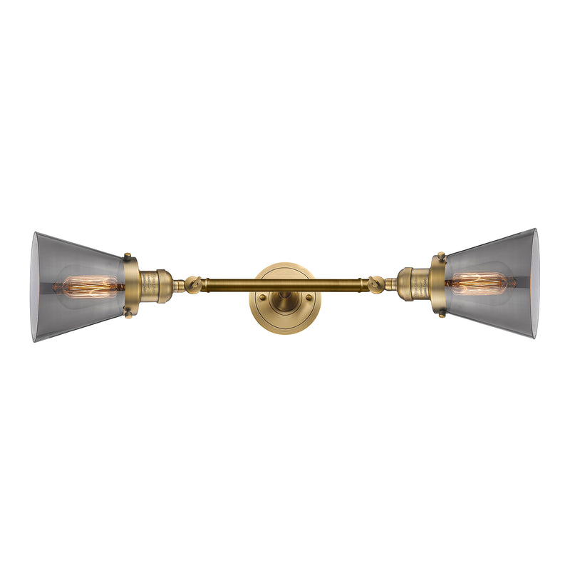 Cone Bath Vanity Light shown in the Brushed Brass finish with a Plated Smoke shade