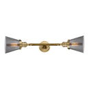 Cone Bath Vanity Light shown in the Brushed Brass finish with a Plated Smoke shade