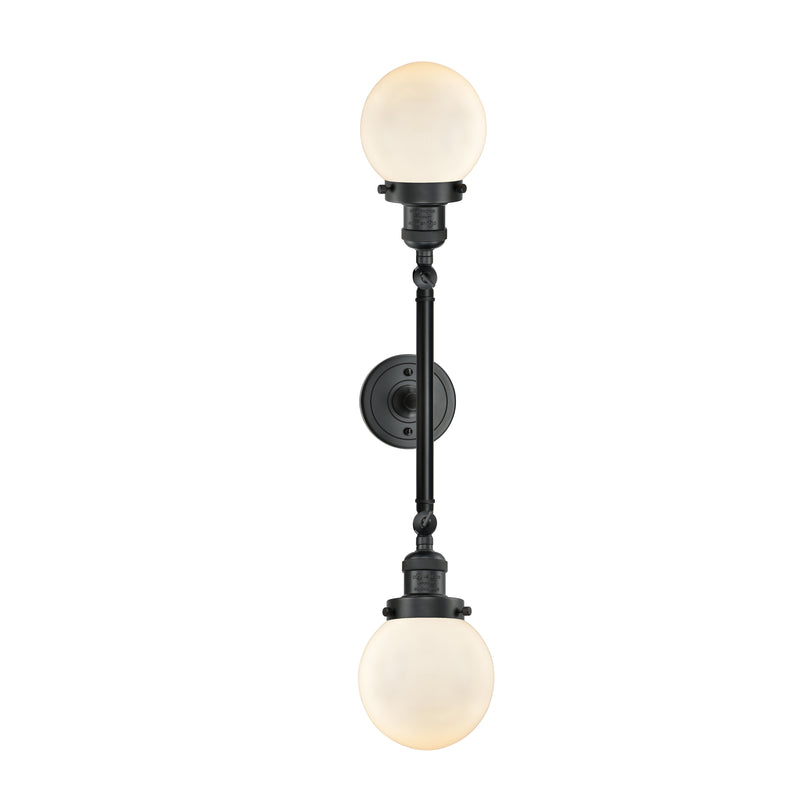 Beacon Bath Vanity Light shown in the Matte Black finish with a Matte White shade