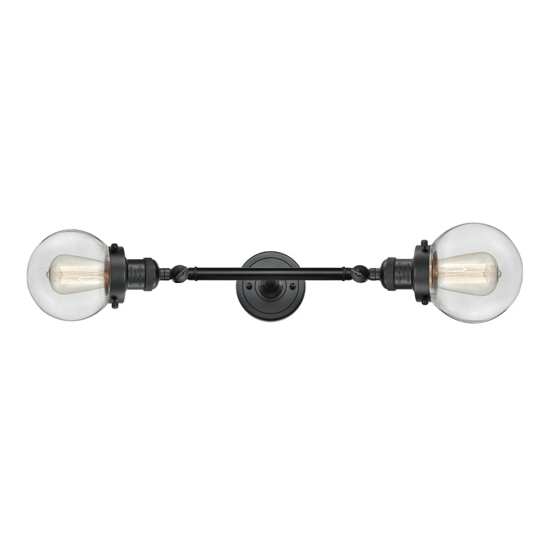 Beacon Bath Vanity Light shown in the Matte Black finish with a Clear shade