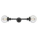 Beacon Bath Vanity Light shown in the Matte Black finish with a Seedy shade