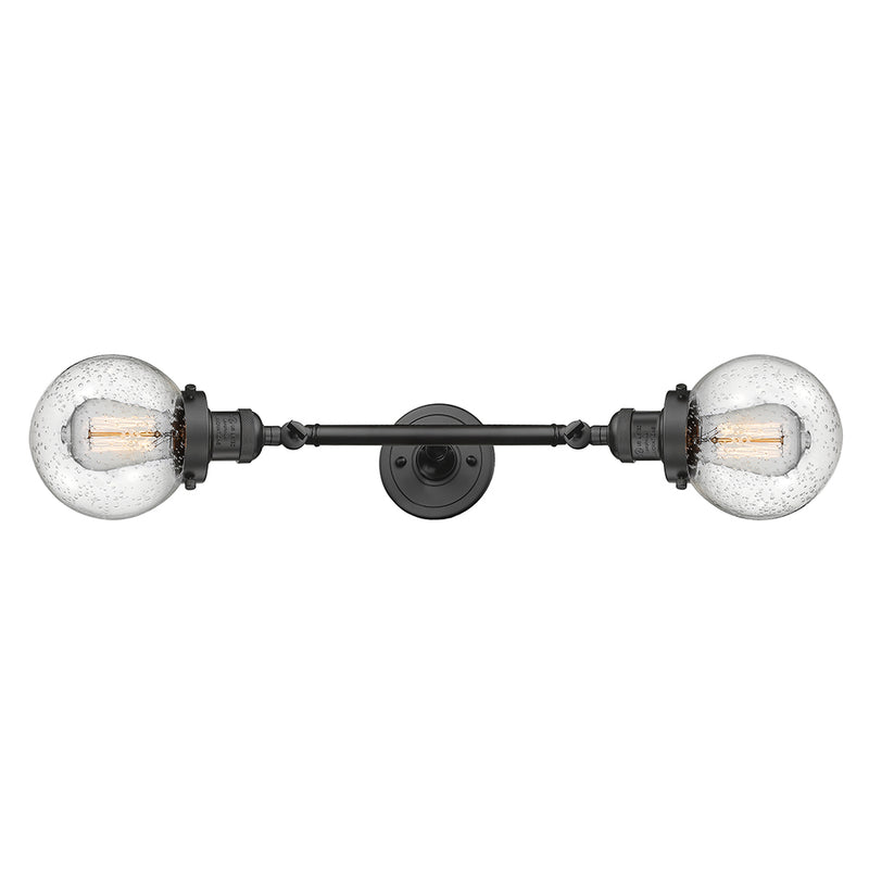 Beacon Bath Vanity Light shown in the Oil Rubbed Bronze finish with a Seedy shade