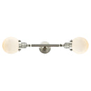 Beacon Bath Vanity Light shown in the Brushed Satin Nickel finish with a Matte White shade