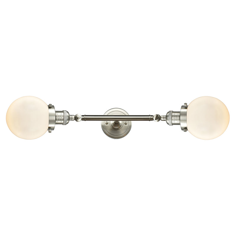 Beacon Bath Vanity Light shown in the Brushed Satin Nickel finish with a Matte White shade