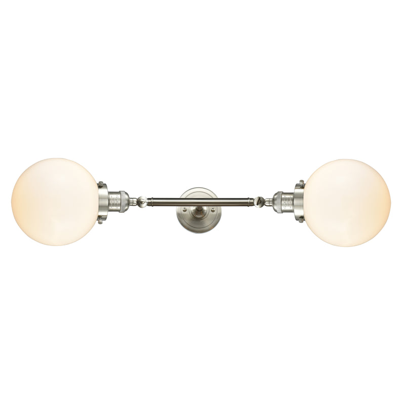 Beacon Bath Vanity Light shown in the Brushed Satin Nickel finish with a Matte White shade