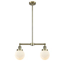 Beacon Island Light shown in the Antique Brass finish with a Matte White shade