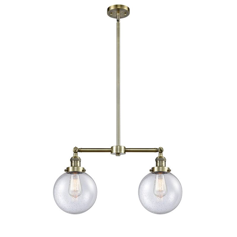 Beacon Island Light shown in the Antique Brass finish with a Seedy shade