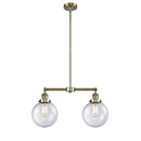 Beacon Island Light shown in the Antique Brass finish with a Seedy shade