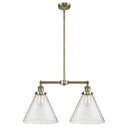 Cone Island Light shown in the Antique Brass finish with a Seedy shade