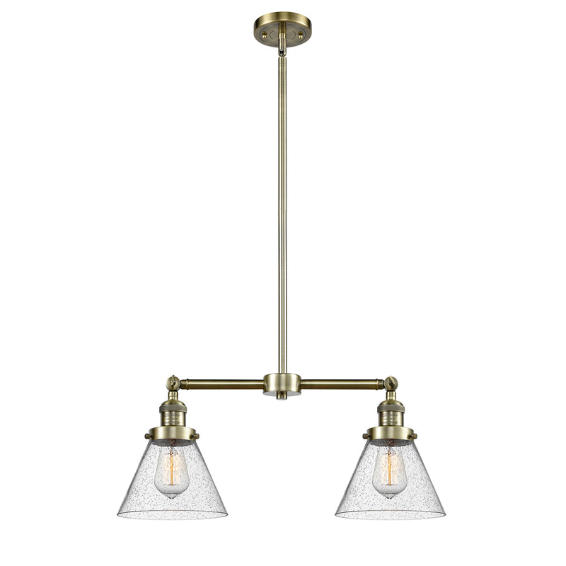 Cone Island Light shown in the Antique Brass finish with a Seedy shade