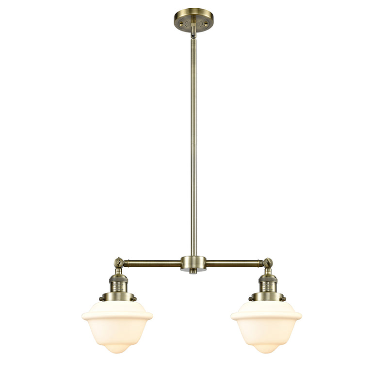 Oxford Island Light shown in the Antique Brass finish with a Matte White shade