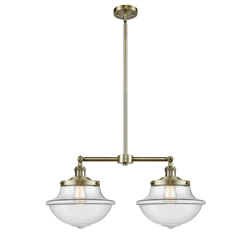 Oxford Island Light shown in the Antique Brass finish with a Clear shade