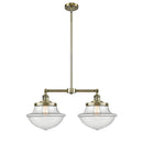 Oxford Island Light shown in the Antique Brass finish with a Clear shade