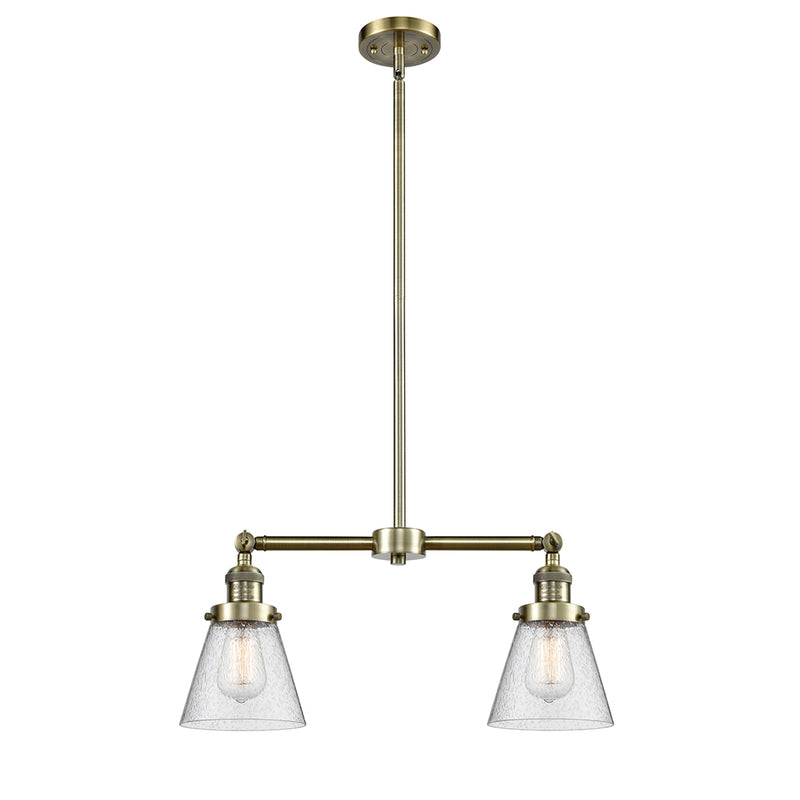 Cone Island Light shown in the Antique Brass finish with a Seedy shade