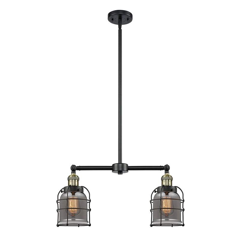 Bell Cage Island Light shown in the Black Antique Brass finish with a Plated Smoke shade