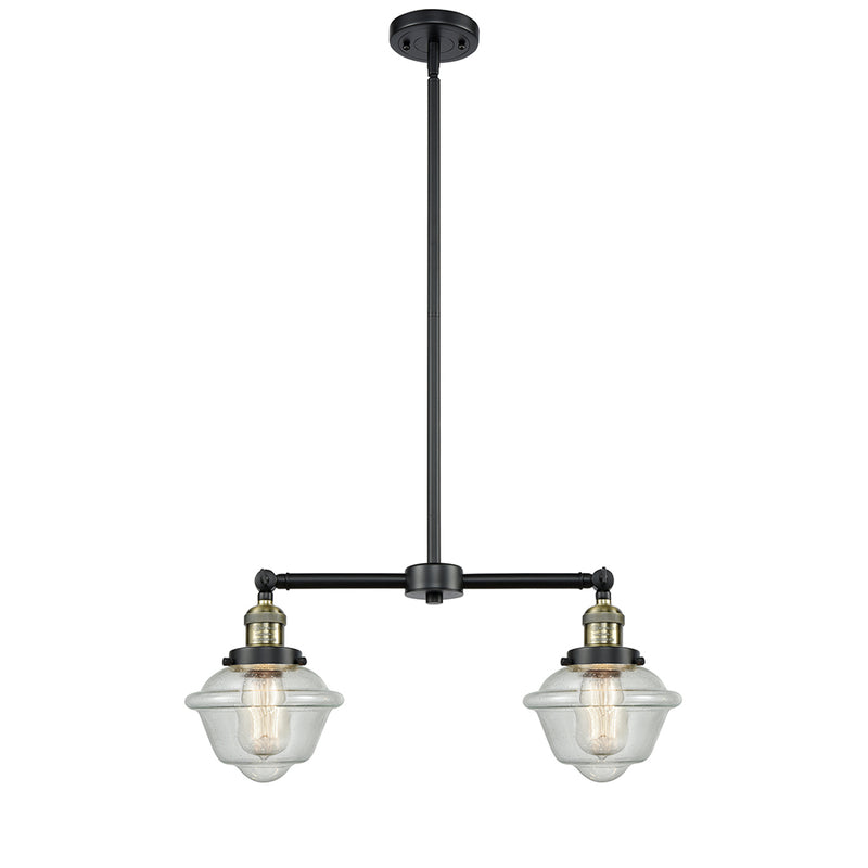 Oxford Island Light shown in the Black Antique Brass finish with a Seedy shade