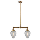 Geneseo Island Light shown in the Brushed Brass finish with a Clear Crackled shade