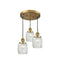 Colton Multi-Pendant shown in the Brushed Brass finish with a Clear Halophane shade