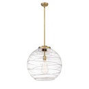 Deco Swirl Pendant shown in the Brushed Brass finish with a Clear shade