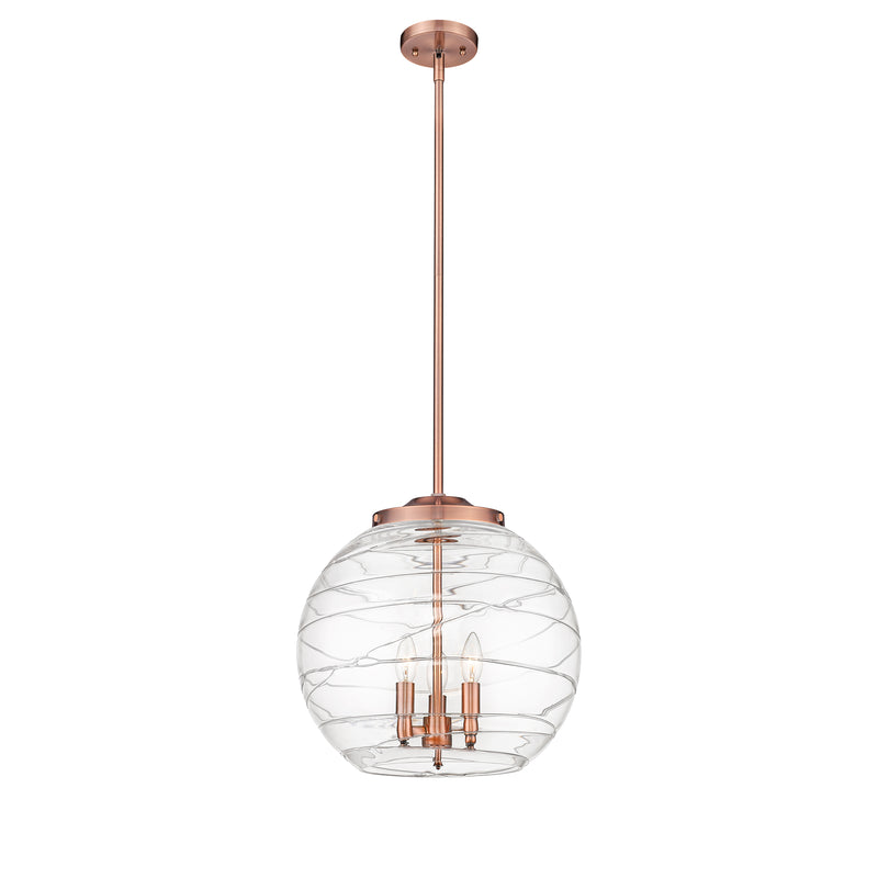 Deco Swirl Pendant shown in the Antique Copper finish with a Clear shade