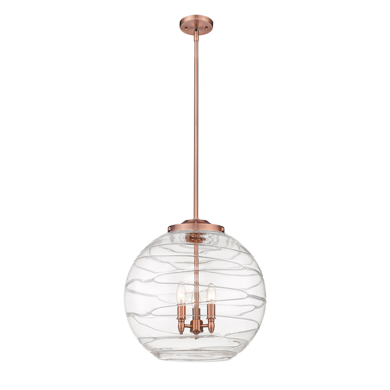 Deco Swirl Pendant shown in the Antique Copper finish with a Clear shade