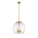 Deco Swirl Pendant shown in the Brushed Brass finish with a Clear shade