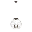 Deco Swirl Pendant shown in the Oil Rubbed Bronze finish with a Clear shade