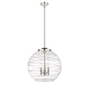 Deco Swirl Pendant shown in the Polished Nickel finish with a Clear shade