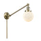 Beacon Swing Arm shown in the Antique Brass finish with a Matte White shade