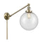 Beacon Swing Arm shown in the Antique Brass finish with a Seedy shade