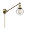 Beacon Swing Arm shown in the Antique Brass finish with a Seedy shade