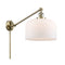 Bell Swing Arm shown in the Antique Brass finish with a Matte White shade