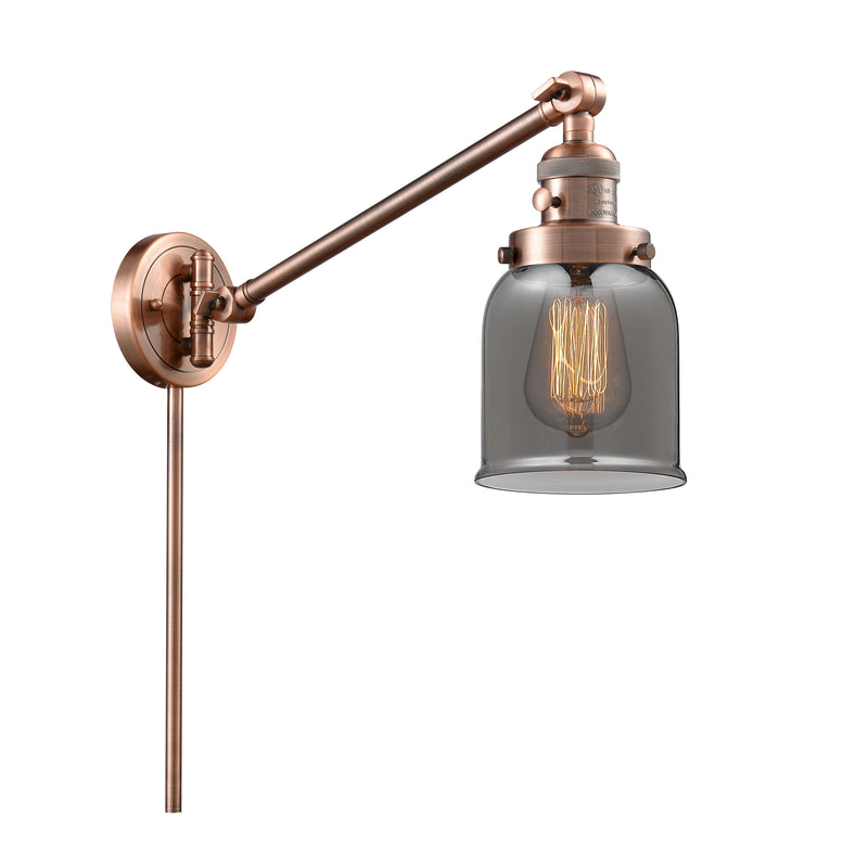 Bell Swing Arm shown in the Antique Copper finish with a Plated Smoke shade