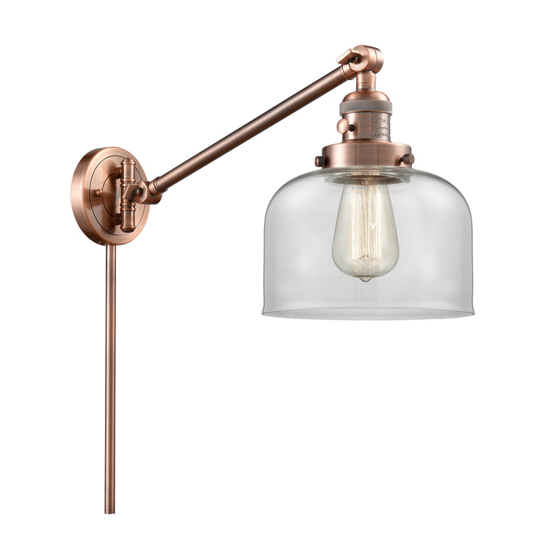 Bell Swing Arm shown in the Antique Copper finish with a Clear shade