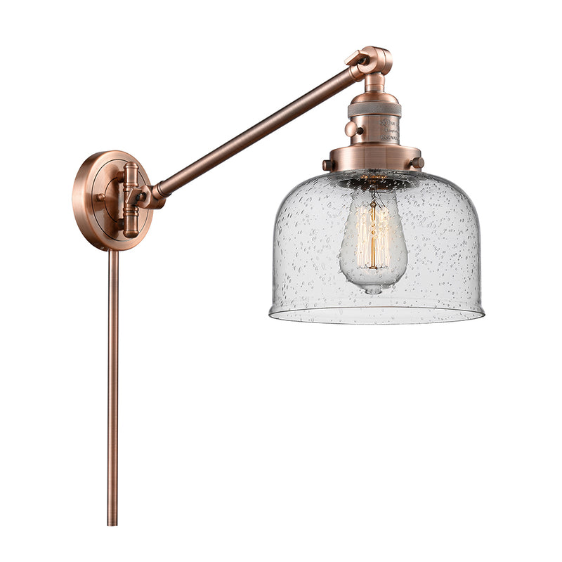 Bell Swing Arm shown in the Antique Copper finish with a Seedy shade