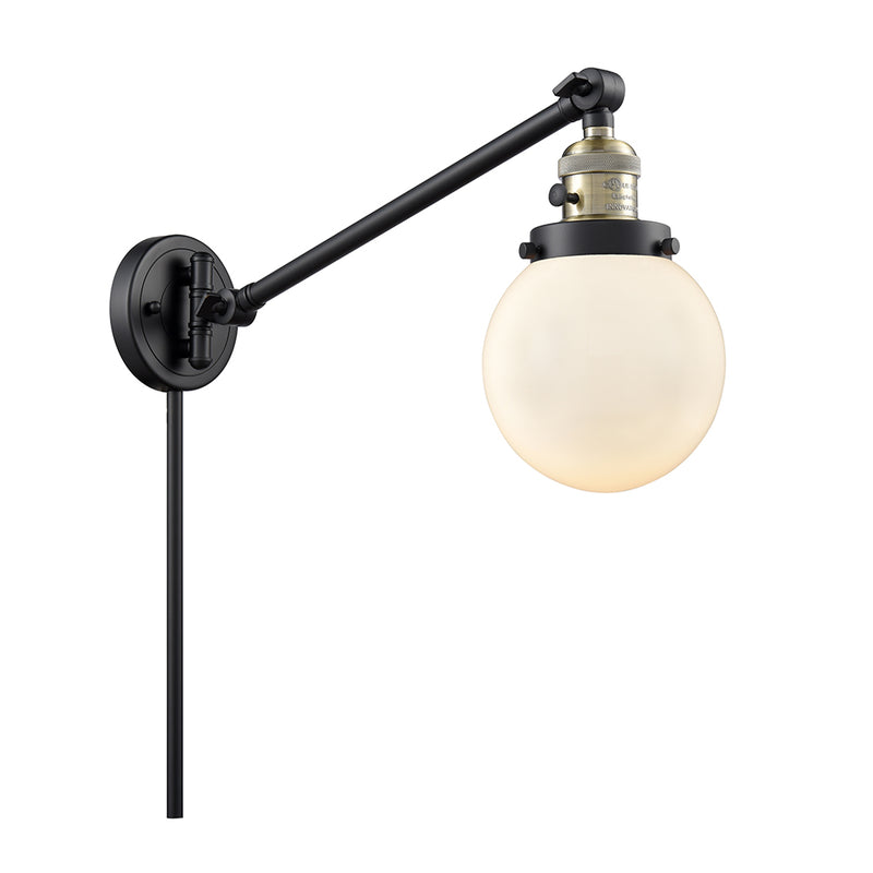 Beacon Swing Arm shown in the Black Antique Brass finish with a Matte White shade