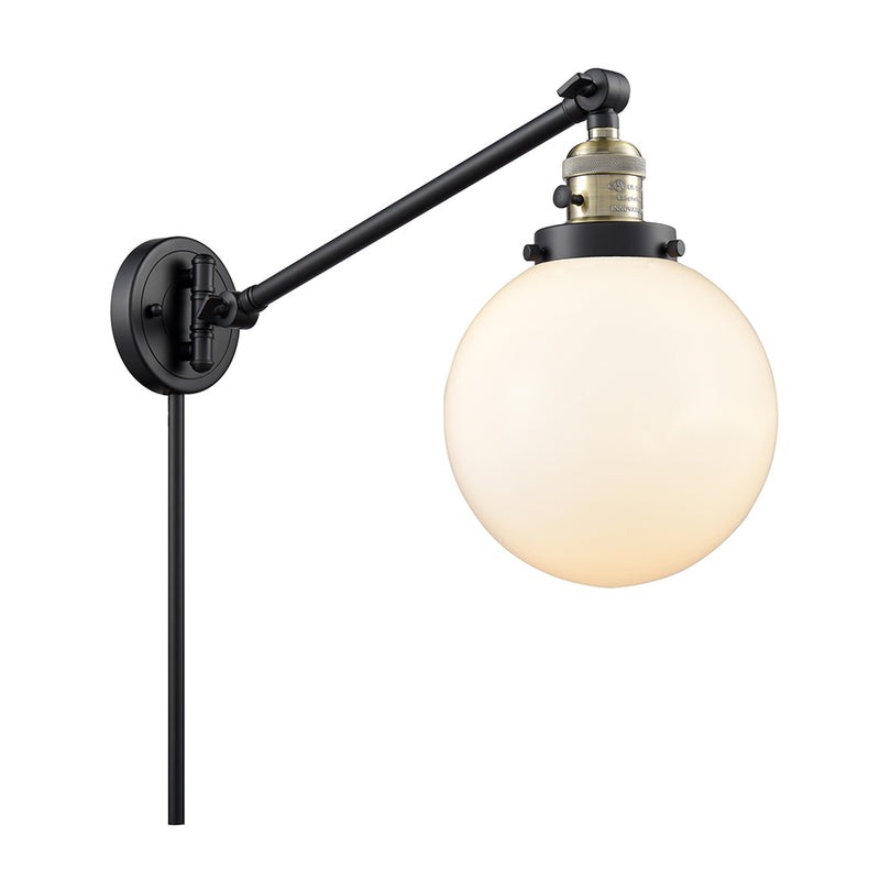 Beacon Swing Arm shown in the Black Antique Brass finish with a Matte White shade