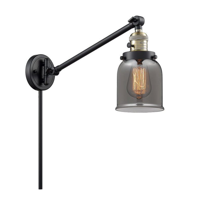 Bell Swing Arm shown in the Black Antique Brass finish with a Plated Smoke shade