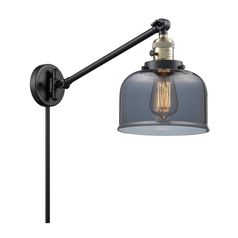 Bell Swing Arm shown in the Black Antique Brass finish with a Plated Smoke shade