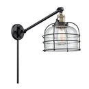 Bell Cage Swing Arm shown in the Black Antique Brass finish with a Seedy shade