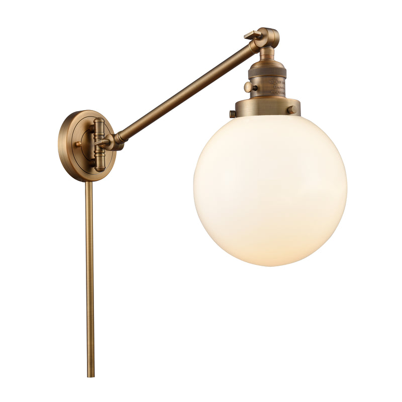 Beacon Swing Arm shown in the Brushed Brass finish with a Matte White shade