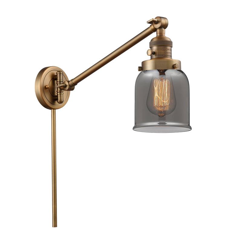 Bell Swing Arm shown in the Brushed Brass finish with a Plated Smoke shade