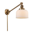 Bell Swing Arm shown in the Brushed Brass finish with a Matte White shade