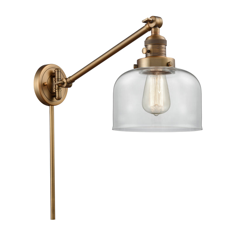 Bell Swing Arm shown in the Brushed Brass finish with a Clear shade