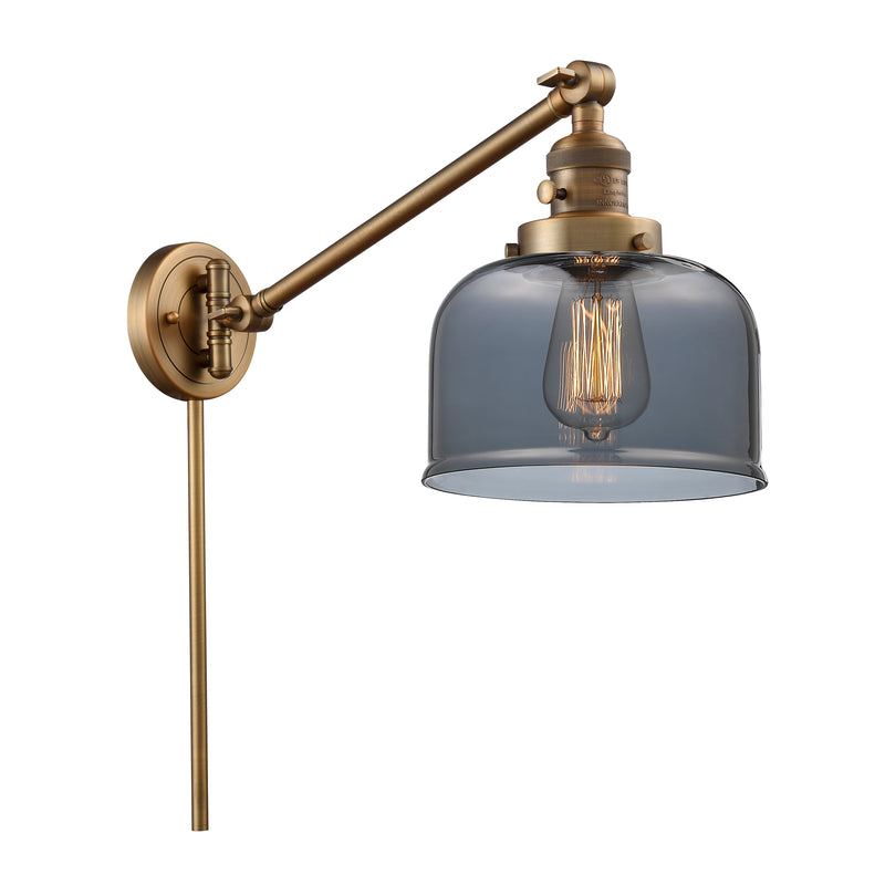 Bell Swing Arm shown in the Brushed Brass finish with a Plated Smoke shade