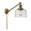 Bell Swing Arm shown in the Brushed Brass finish with a Seedy shade