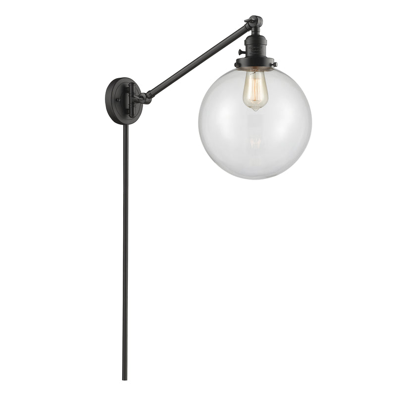 Beacon Swing Arm shown in the Oil Rubbed Bronze finish with a Clear shade