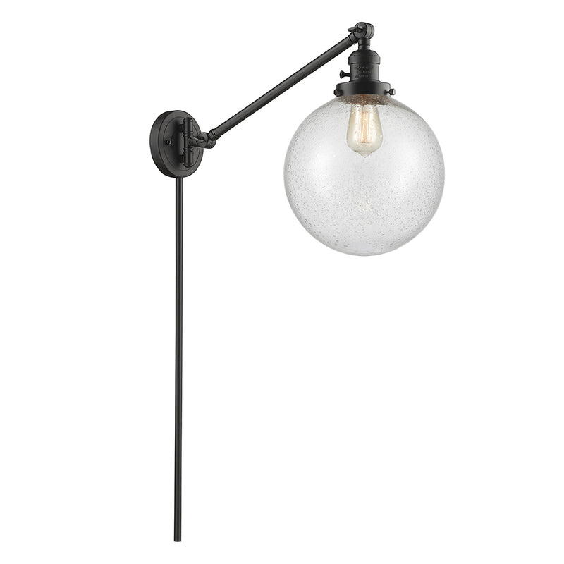 Beacon Swing Arm shown in the Oil Rubbed Bronze finish with a Seedy shade