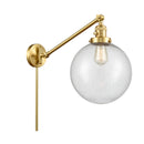 Beacon Swing Arm shown in the Satin Gold finish with a Seedy shade